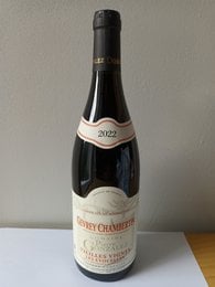 Dark red wine bottle, Gevrey Chambertin label, vintage 2023, elegant French burgundy wine