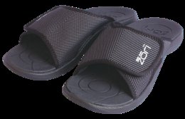 Black slip-on slippers with a textured, mesh-like upper and a cushioned sole. The slippers have the brand name "Zori" printed on the side.