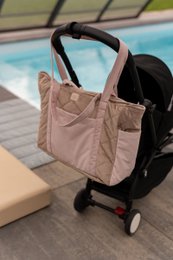 Pink beige quilted travel bag with handles, spacious weekend tote, lightweight portable luggage