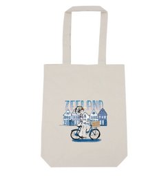Delft blue tote bag with Zeeland girl on bicycle illustration, suitable for shoulder carry.