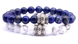Beaded bracelet with lapis lazuli and white howlite stones, featuring a decorative metal accent.