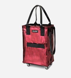  A small, cosmic red shopping bag with a built-in cover. The bag has a rectangular shape and appears to be made of a durable, water-resistant material. It has a black handle and wheels for easy transport.