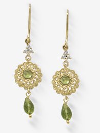 Gold-plated filigree earrings with peridot drops, a statement accessory with a vintage-inspired design.