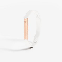 A self-defense bracelet made of pearl and rose gold, designed for fitness and sports activities. The bracelet features a sleek, minimalist style and is suitable for everyday wear.