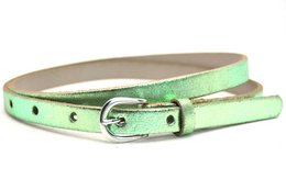 Metallic leather belt in various colors including pink, green, blue, silver, and gold. The belt has a classic buckle closure and is made of 100% cowhide leather.