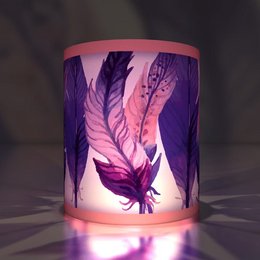 Elegant tea light holder with feather motif in pink and purple colors.