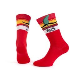 Red socks with colorful stripes and patterns, featuring the Mexico 1986 logo. The socks appear to be made of a soft, comfortable material and are designed for casual or athletic wear.