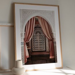 Ornate archway with intricate carved details, red curtains, and a wooden bench inside. This poster depicts an oriental-style hallway or entryway.