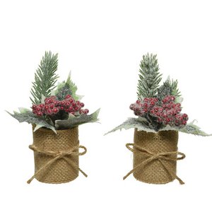 Christmas arrangement with berries in a jute pot