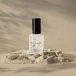 Cuticle Remover - Emollient for cuticles - 15ml. Clear, liquid product in a glass bottle with a black cap.