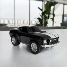  Black toy racing car Ford Mustang with sleek, sporty design.