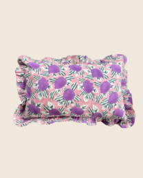  Rectangular cushion with a violet garden floral pattern and ruffled edges.