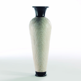 Tall, cylindrical terracotta vase with a cream and black color scheme and a textured, feathered pattern.