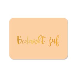  Greeting card with gold foil text "Bedankt juf" (Thank you teacher) on a peach background.
