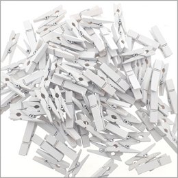 White plastic clothespins, 100 pieces, for party and event decorations.