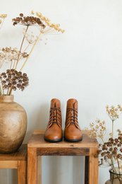  Cognac brown leather boots with lace-up closure, available in sizes 35-42, suitable for women's casual or formal wear.
