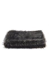 Soft, plush, and cozy silver faux fur throw blanket for bedside use.