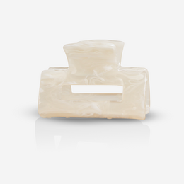 Quad white sand hair clip made of durable plastic material.