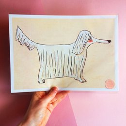 Illustrated art print featuring a whimsical, stylized drawing of a dog with long, flowing fur and a red nose. The print has a warm, earthy color palette and a playful, hand-drawn aesthetic.
