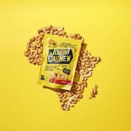Roasted salted cashew nuts in a yellow package with the text "Johnny Cashew" on a yellow background.