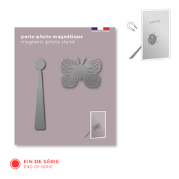 Magnetic metal photo holder with a butterfly design. The holder is made of metal and features a butterfly-shaped magnetic surface for displaying photos.