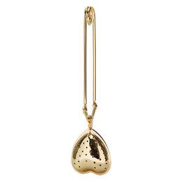 Gold-colored tea infuser with heart-shaped perforations, ideal for steeping loose leaf tea.