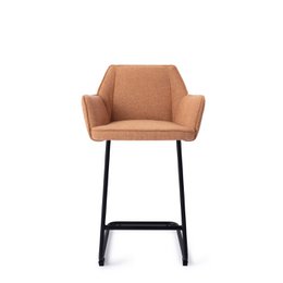 Tall, modern bar chair with an arched backrest and black metal frame. Available in a variety of neutral fabric colors including beige, gray, and tan.