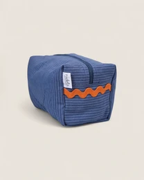 Blue toiletry bag with ocean wave pattern, textured fabric, kids storage pouch, marine color