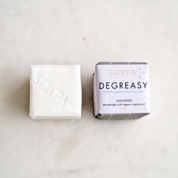 Organic cleaning soap bar made with natural ingredients, rectangular shape, white color with blue and gold text "DE GREASY" printed on the packaging.