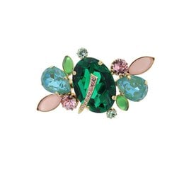 Colorful brooch with oval-shaped turquoise stone, yellow and pink crystals, and gold-tone metal setting.