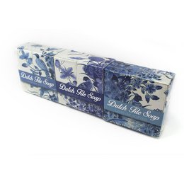 A set of 3 delft blue tile-patterned soap bars. The soap bars feature a floral and butterfly design in shades of blue and white.