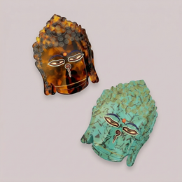 Colorful fish-shaped hair clip made of plastic, available in rose and green colors.
