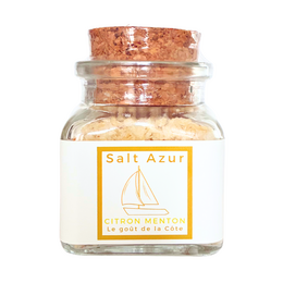  Lemon Menton salt, a spice mix in a glass jar with a cork lid. The salt has a light yellow color and appears to be coarse-grained. The label on the jar indicates it is a "Salt Azur" product.