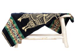  Ecuadorian alpaca mini blanket in navy blue with colorful alpaca and geometric patterns. Reversible wool throw for outdoor decor.