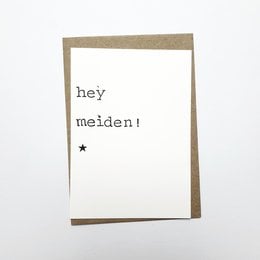 A greeting card with the text "hey maiden!" printed on a plain white background.