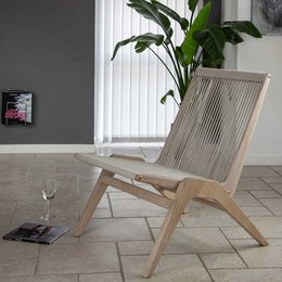 Wooden chair with beige woven seat and backrest, featuring a minimalist, modern design.