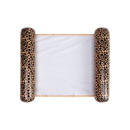  A brown and tan hammock with a giraffe print pattern. The hammock has a wooden frame and is designed for outdoor use.