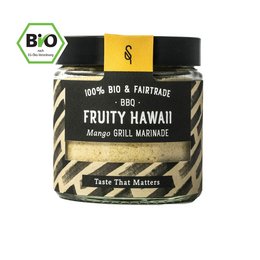 Organic Fruity Hawaii spice blend with mango, chili, and turmeric flavors. Vibrant yellow-orange color. Suitable for seasoning a variety of dishes.