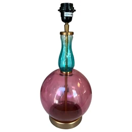A tall, round table lamp with a purple glass base and a teal glass shade. The lamp has a brass-colored metal base and hardware.