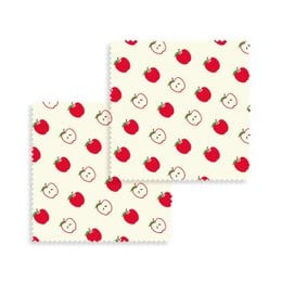 Set of 2 beeswax food wraps with a repeating pattern of red apples and apple slices on a light background. Reusable, eco-friendly alternative to plastic wrap.