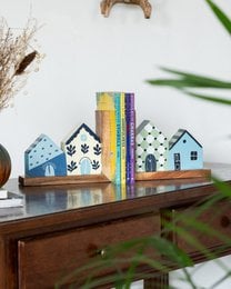 Hand-painted wooden bookends with blue house designs, mountain shapes, decorative book holders, cottage style home decor.