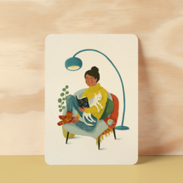A postcard with a whimsical illustration of a person reading a book in a cozy, abstract setting.
