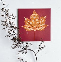 Decorative tile with a large, pink rose-like flower and green leaves. The tile has a simple, geometric design style.