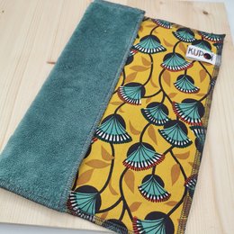 Absorbent, colorful towels with a repeating fan-shaped pattern in shades of blue, yellow, and green.