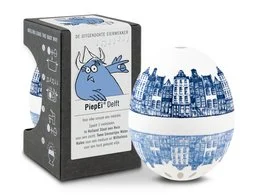 A white ceramic egg-shaped timer with a blue and white Delft-style pattern depicting a cityscape. The timer is designed to help monitor the cooking time of boiled eggs.