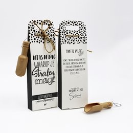 Bath salts in a polka dot package with a wooden scoop. The product is described as "This is the day when you can shine".