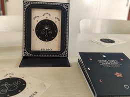 Astrology-themed photo frame and pouch with zodiac map design, available in French and English versions.
