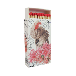 Long matches in a vintage-style box with a parrot design, featuring a floral pattern with pink flowers.