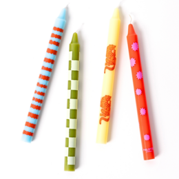 Set of 4 retro-style dinner candles in various colors and patterns, including solid colors, stripes, and a textured design.