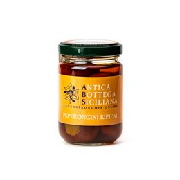  Pate of green olives in a glass jar. The jar has a black lid and the label shows the brand "Antica Bottega Siciliana" and indicates the product is an olive pate.